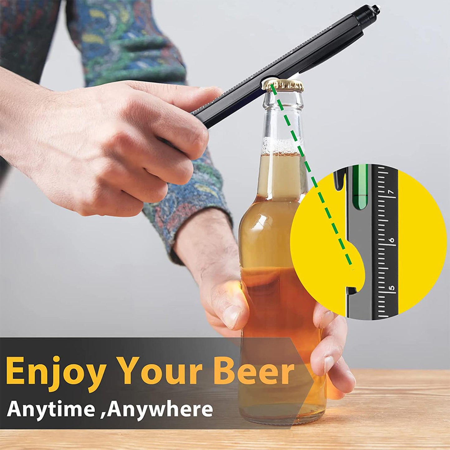 Person using a multi-functional pen tool to open a beer bottle, showcasing its usability and convenience.